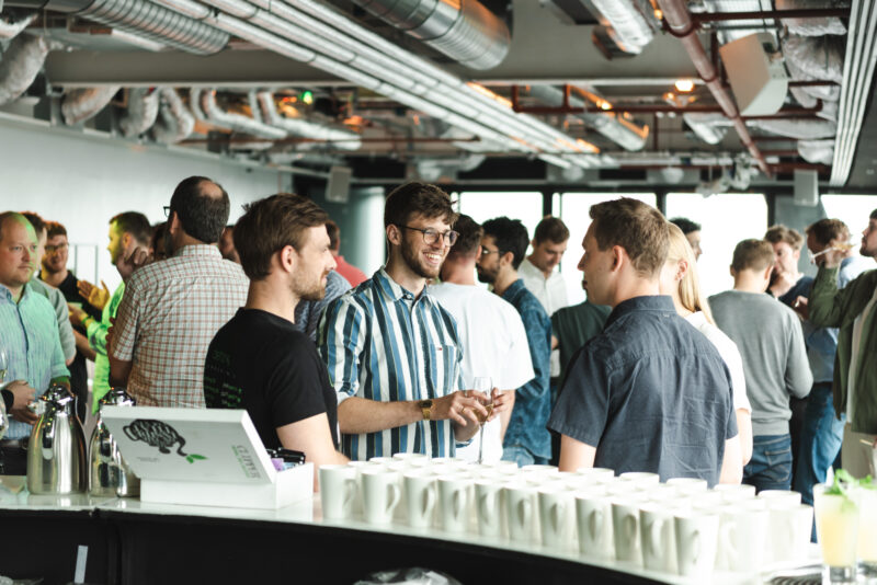 Delegates take a break and network during a corporate event.