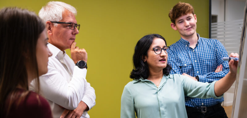 People prepare for a corporate headshot session